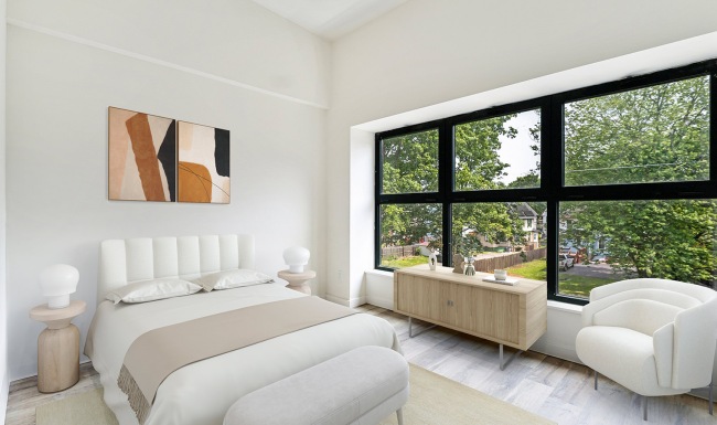 bedroom with bed and large window